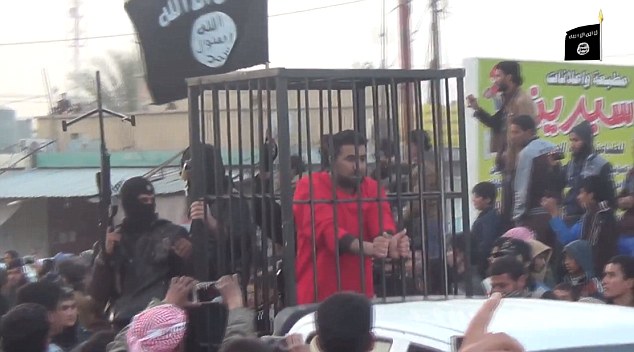 The prisoners were driven on the backs of pick-uyp trucks along with flag-waving gun-toting militants