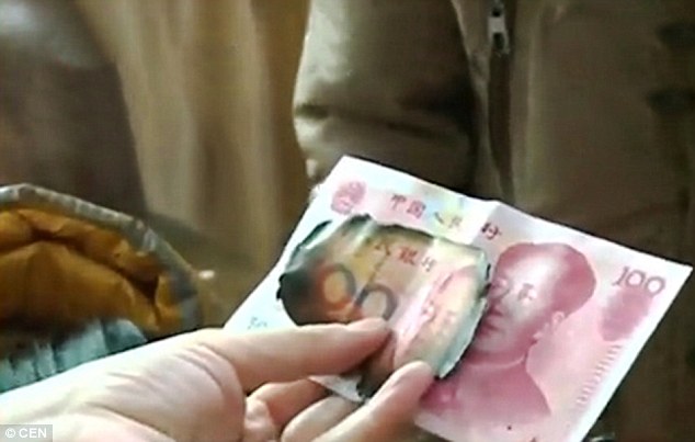 Bank of China officials refused to replace the burned money as less than half of each note was still intact