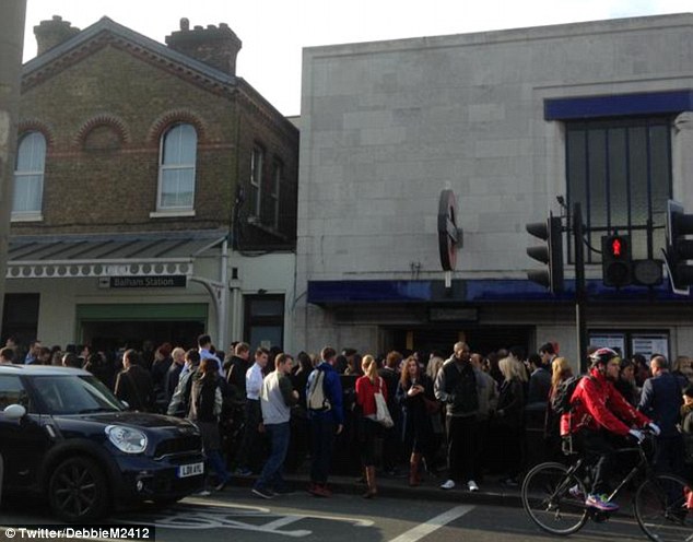 Waiting: Queues outside Balham station. Transport for London denied the incident was due to overcrowding