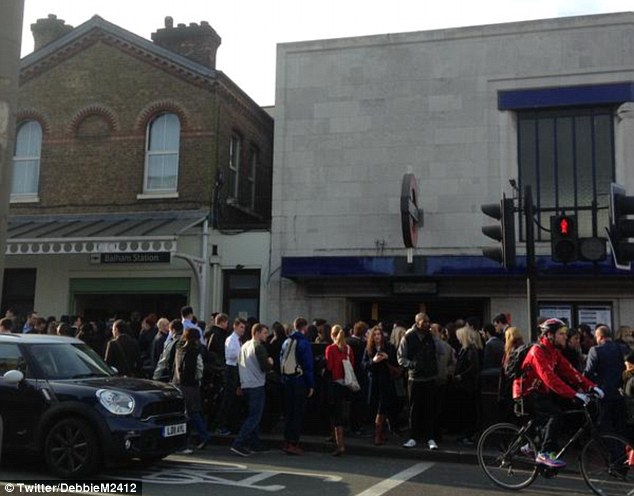 Waiting: Queues outside Balham station. Transport for London denied the incident was due to overcrowding
