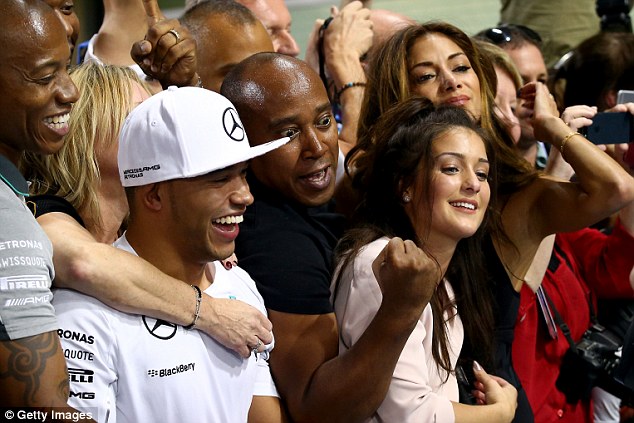 Hamilton celebrates his elder brother's championship triumph at last season's Abu Dhabi Grand Prix 