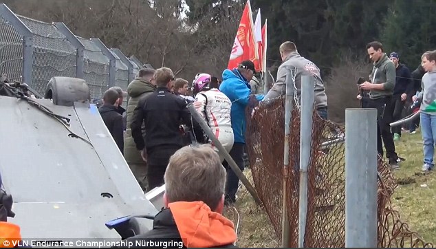 Mardenborough is seen leaving the car after his terrifying collision in Germany