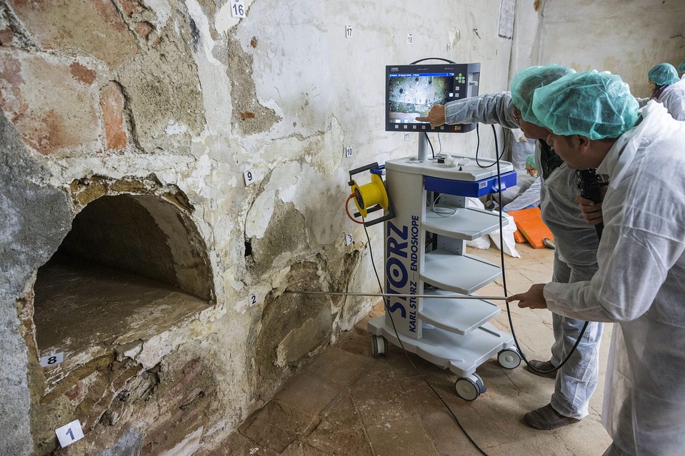 Experts use an endoscope to look inside a niche on Jan. 24 as they search for the remains of Spanish writer Miguel de Cervantes in a convent in Madrid.