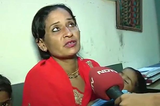 These three children abandoned by their dad at a railway station were rescued after local journalist Abhishek Shukla, 33, tweeted a photo of them. Pictured:The mother of the abandoned children