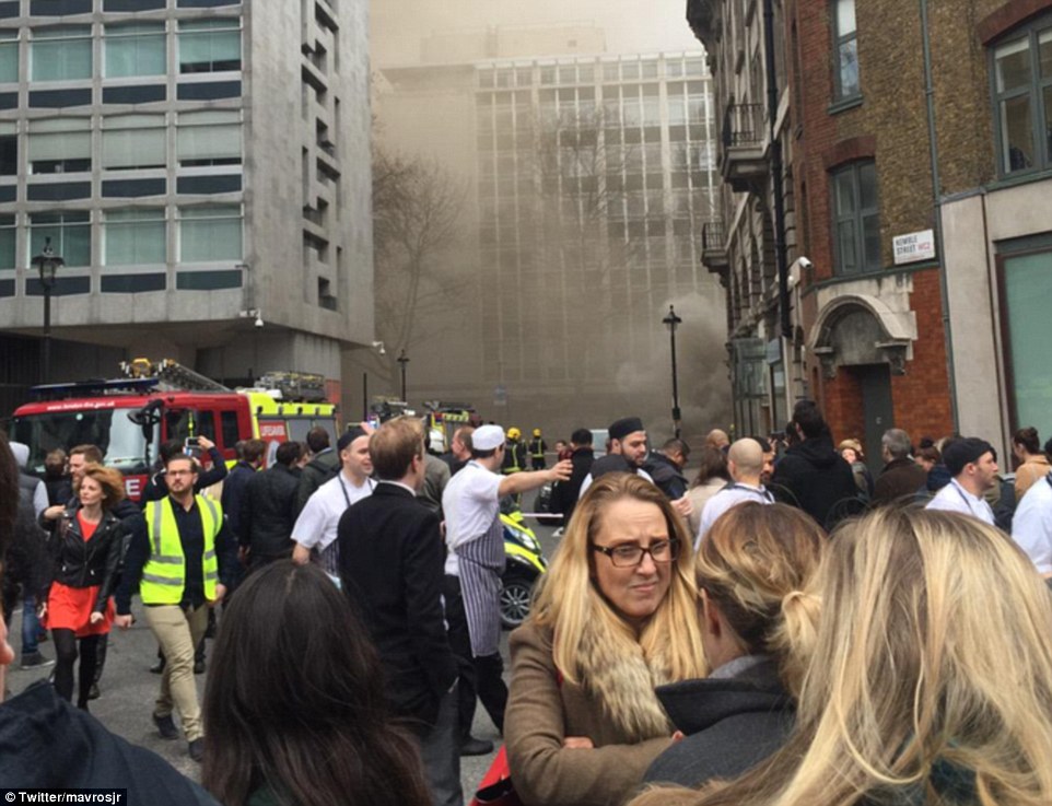 Outside: This photograph posted on Twitter from Kemble Street shows the scenes on the streets as people are evacuated