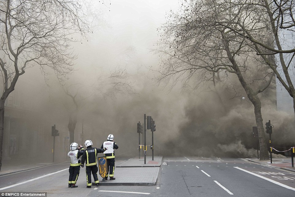 Smoke: Firefighters said they were 'working closely with the various electricity companies involved to identify the source and extent of the fire'