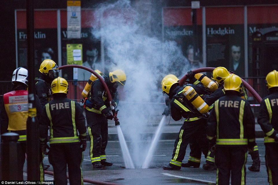 Firefighters: When the hole was widened the team moved in and directed two jets of water into the pit in an attempt to fully extinguish the blaze