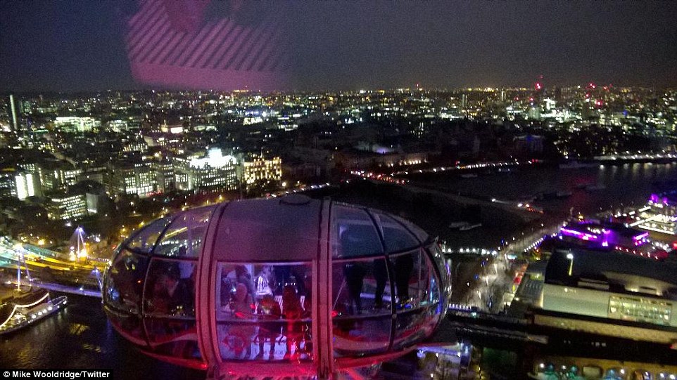 Darkness: Thousands of buildings in the area to the centre right of this photo - taken from the London Eye - were without electricity last night