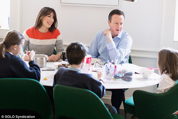 Breakfast and the family enjoy porridge – the pot is on the table in front of Mrs Cameron, who wears a cashmere grey, red and white Chinti and Parker sweater (£295). A box of Weetabix Organic is also just visible. The black mug is from Whittard, while the green chairs are by Knoll Saarinen, and cost £816 each. On the white marble breakfast table (£750 from amodernworld.co.uk) is a plastic tub containing toothbrushes, hairbrushes and nail scissors. There’s also a wicker basket containing Boots dietary supplements