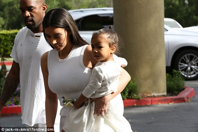Floral fun: Kim's tot had one hand full with a headband adorned with colourful flowers