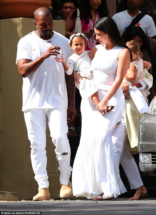 Awww: Kim was unable to take her eyes off her little girl as they left church