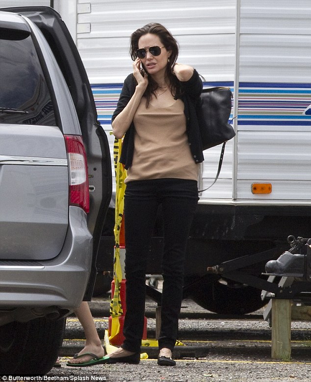 Manic Monday? Angelina Jolie certainly seemed to be feeling the pressure as she took her children to visit their faith on set in New Orleans, Louisiana, on Monday