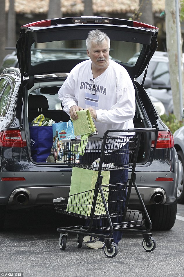 Going incognito: the all-American TV craftsmen loaded up the back of his vehicle with groceries
