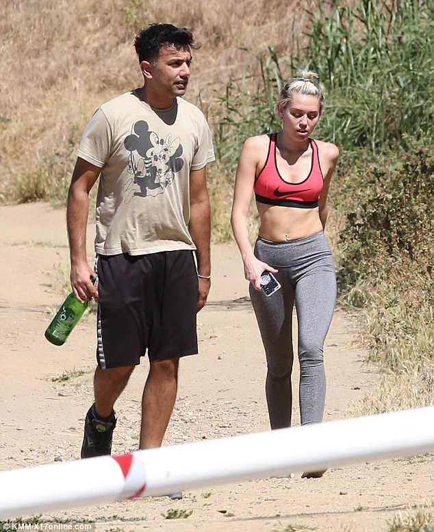 Friendly fun: She was joined for her sun-soaked hike by a male pal