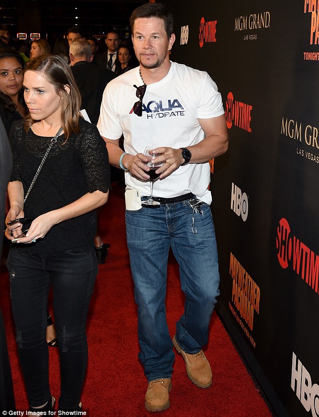 Bottoms up: Mark Wahlberg cradled a drink as he made his way into the Showtime and HBO VIP pre-fight party at the MGM Grand