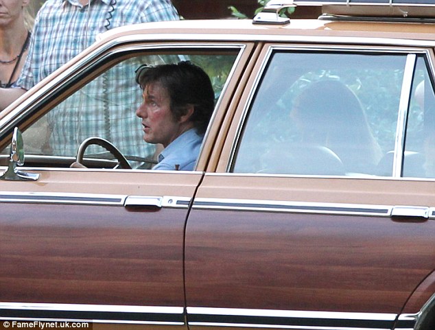 'Bruised': The 52-year-old actor sported faux bruises on the left side of his face after what looked like a rough and tumble day at work 