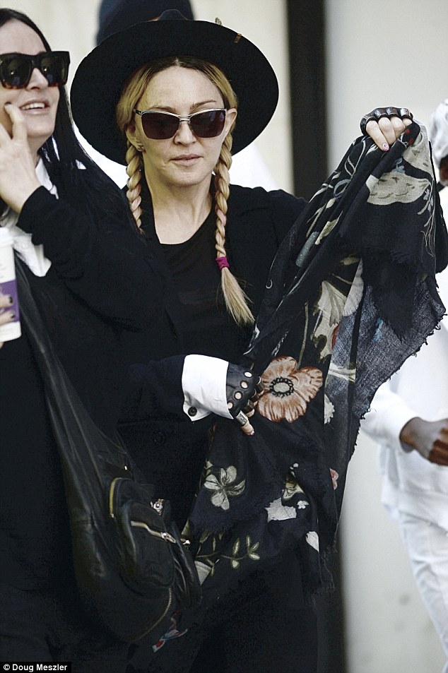 Here she comes! Madonna arrived to The Kabbalah Centre in New York on Saturday with her son David Banda