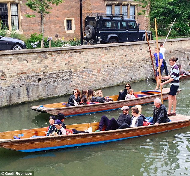 Family affair: The Beckhams were spotted glided down the River Cam in Cambridge on Monday afternoon in two separate punts 