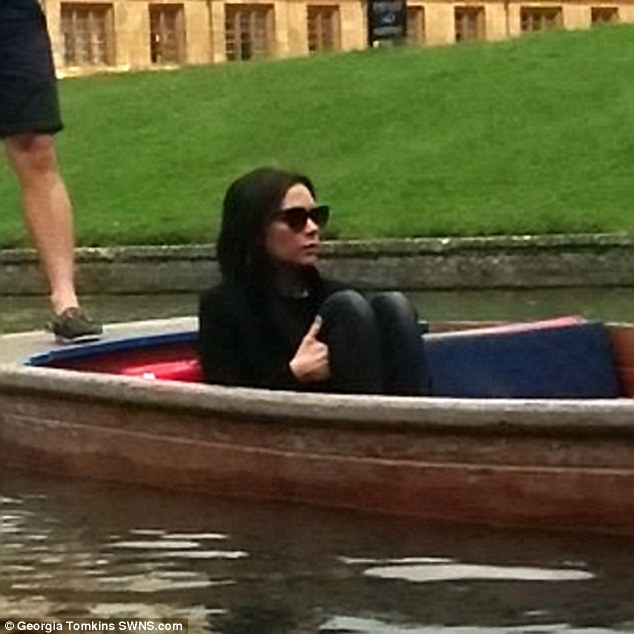 Relaxed; Victoria appeared to be enjoying her fun day on the river with her family and looked suitably stylish in shades and leather trousers 