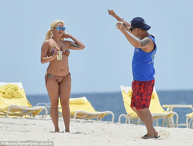 Impressed? The singer's pal appeared to be doing his best to match the superstar's dance skills