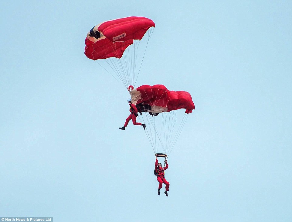 Onlookers have said they felt 'sick' as they watched them tangled together and swifly falling towards the ground 