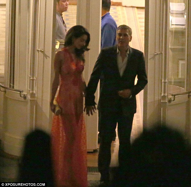 Hold my hand: George offered his hand to his wife as they prepared to head home after the evening out