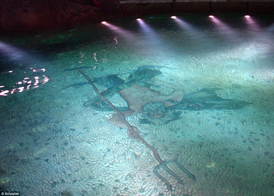 The secret underwater cave  has a mosaic of Poseidon, the god of the sea, holding a trident tiled on the floor and leads out towards the sea