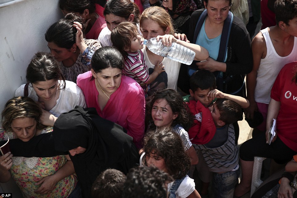 Thirst: Hundreds staged a sit-in in Kos town earlier this morning. 'We want papers, we want to eat!' they chanted