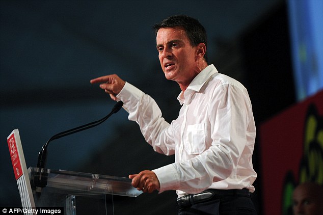 Valls pictured delivering his speech the members of the Socialist party, many of who booed him for his economic policies