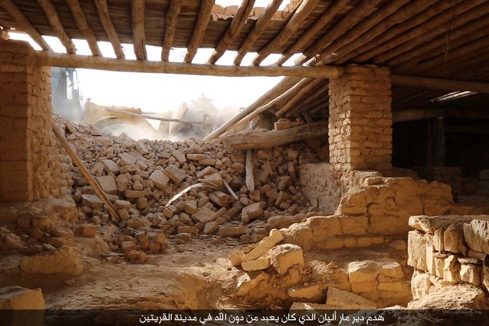 An image published by the media branch of Islamic State allegedly showing jihadists using a bulldozer to destroy the ancient monastery of Mar Elian in the central Syrian town of Qaryatain.