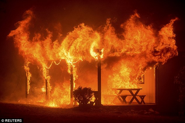 A house burns as the Butte fire rages through Mountain Ranch, California September 11, 2016