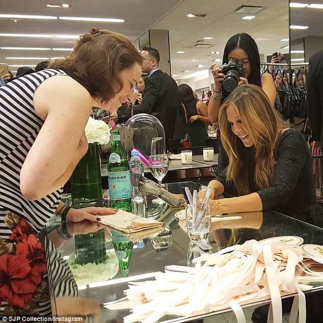 The moment they've been waiting for: SJP couldn't hide her smile while signing autographs for fans purchasing shoes from her new collection