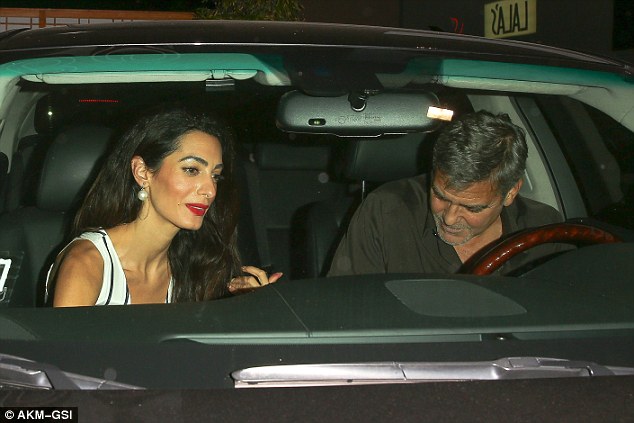 More laughs: The couple looked to share a joke as they fastened their seat-belts