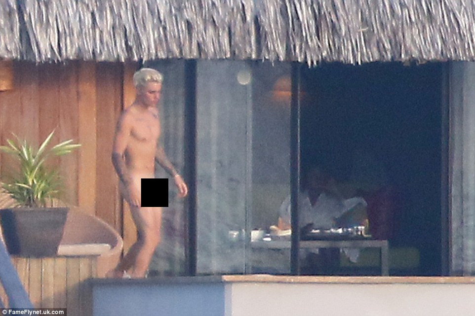 Enjoying the view? Jayde could be seen kicking back just inside the villa as Justin went naked on the deck