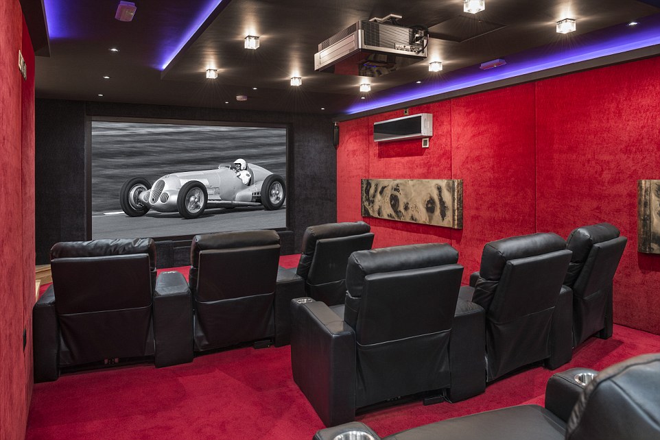 The entertainment hall on the lower ground floor includes a large cinema room, bar and fully equipped gymnasium: Even the walls of the cinema room are decked out in plush red carpet
