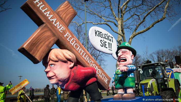 Η “Μέρκελ” σήκωσε τον σταυρό του προσφυγικού στο καρναβάλι του Ντίσελντορφ- ΦΩΤΟ