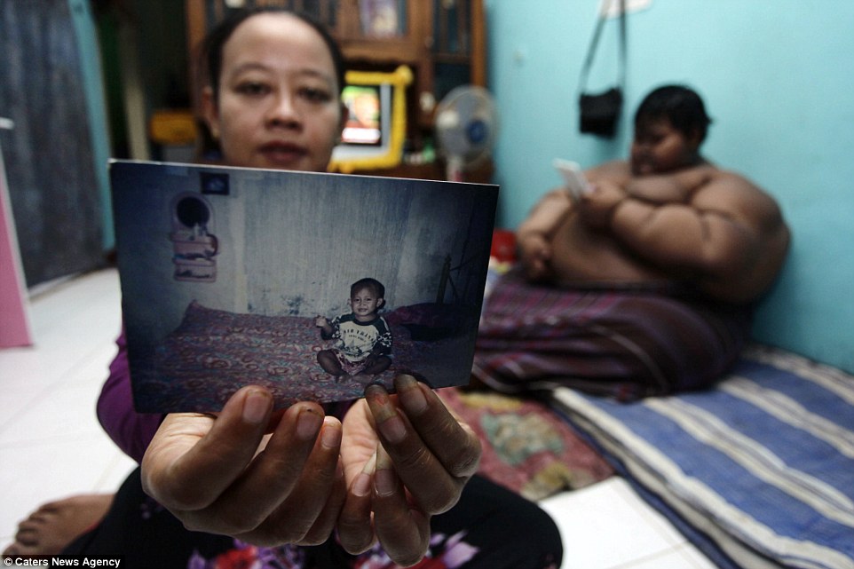 'My son is growing up at a rapid rate and I am worried for his health. I do not know any other way to stop him from gaining more weight than to give him less food,' his mother (pictured) said