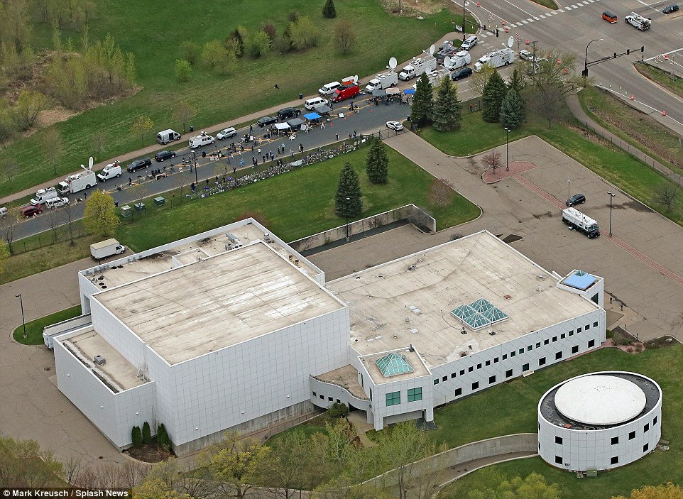 Vast estate: An aerial shot shows Prince's large plot, which includes the complex as well as a smaller building situated in the garden of the property; the keen press presence can also be seen on the road 