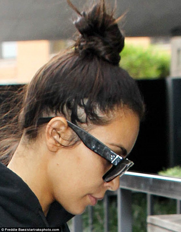 Losing her locks: Kim Kardashian revealed hair loss on the side of her head as she arrived home from the gym in New York City on Monday