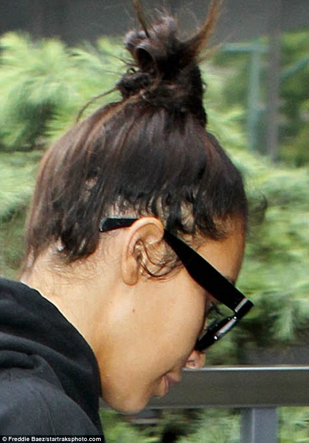 Covering it up: It seems the reality star may have been relying on weaves to boost her locks after welcoming her son Saint in December