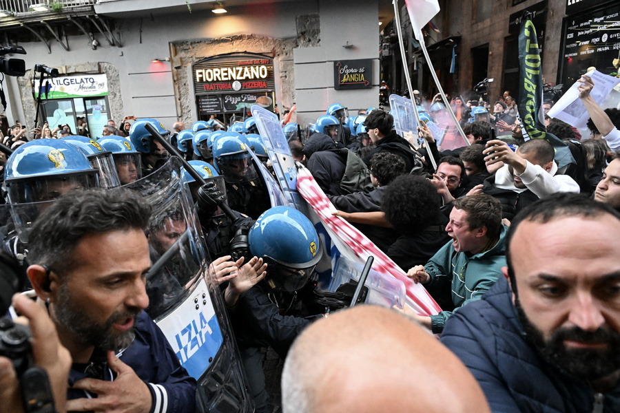 Demonstrators clash with riot police officers in Naples, Italy, 08 April 2024. The demonstrators tried to cross the security cordon to get to the San Carlo Theatre, with the aim of protesting the concert scheduled for the 75th anniversary of NATO. The North Atlantic Treaty Organisation (NATO) was founded 75 years ago on 04 April 1949, and now has 32 member states.