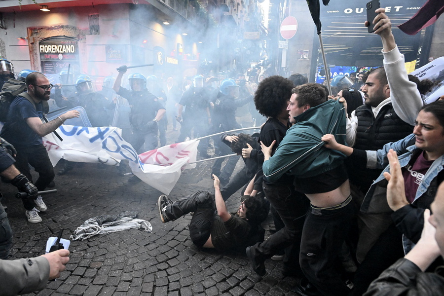 Demonstrators clash with riot police officers in Naples, Italy, 08 April 2024. The demonstrators tried to cross the security cordon to get to the San Carlo Theatre, with the aim of protesting the concert scheduled for the 75th anniversary of NATO. The North Atlantic Treaty Organisation (NATO) was founded 75 years ago on 04 April 1949, and now has 32 member states.