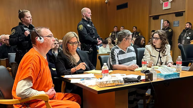 From left, James Crumbley, defence lawyer Mariell Lehman, Jennifer Crumbley, and defence lawyer Shannon Smith await sentencing in Oakland County, Mich., court on Tuesday. The Crumbleys were convicted of involuntary manslaughter for a school shooting committed by their son in 2021.