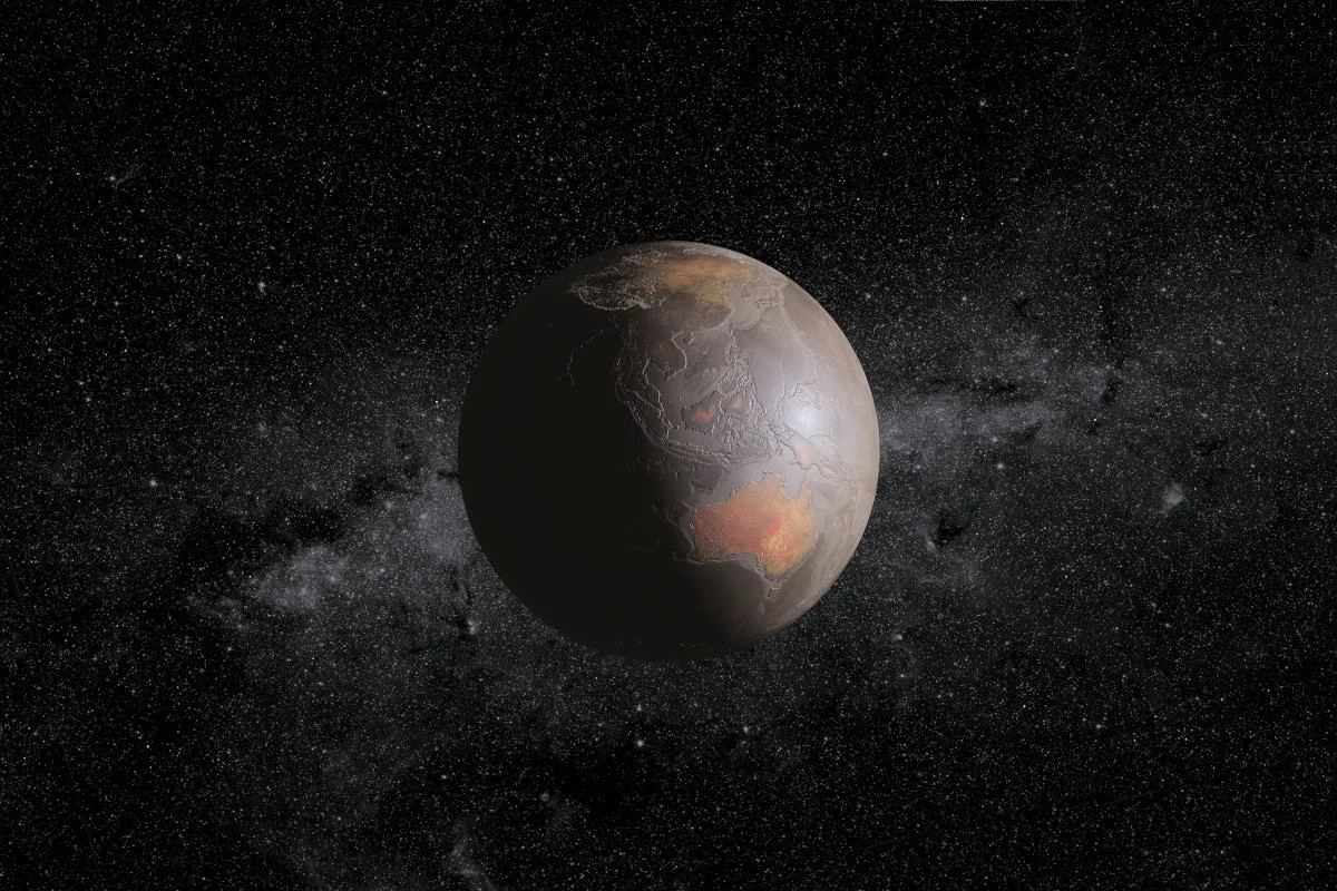 Απεικόνιση της άγονης Γης όπως θα έμοιαζε μετά από ακραία κλιματική αλλαγή ή άλλη καταστροφή. Στο φόντο, η σειρά από τ' αστέρια που σχηματίζουν τον Γαλαξία στον νυχτερινό ουρανό. Χωρίς την μαγνητόσφαιρα που παράγεται από τον πηρύνα της, η Γη δεν θα είχε προστασία απέναντι στον ηλιακό αέρα και θα κατέληγε να είναι ένας άγονος, χωρίς ζωή βράχος. Φωτογραφία: Science Photo Library 